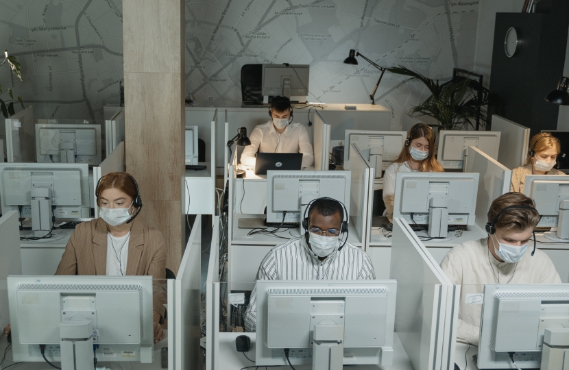 Call centre workers wearing coronavirus masks